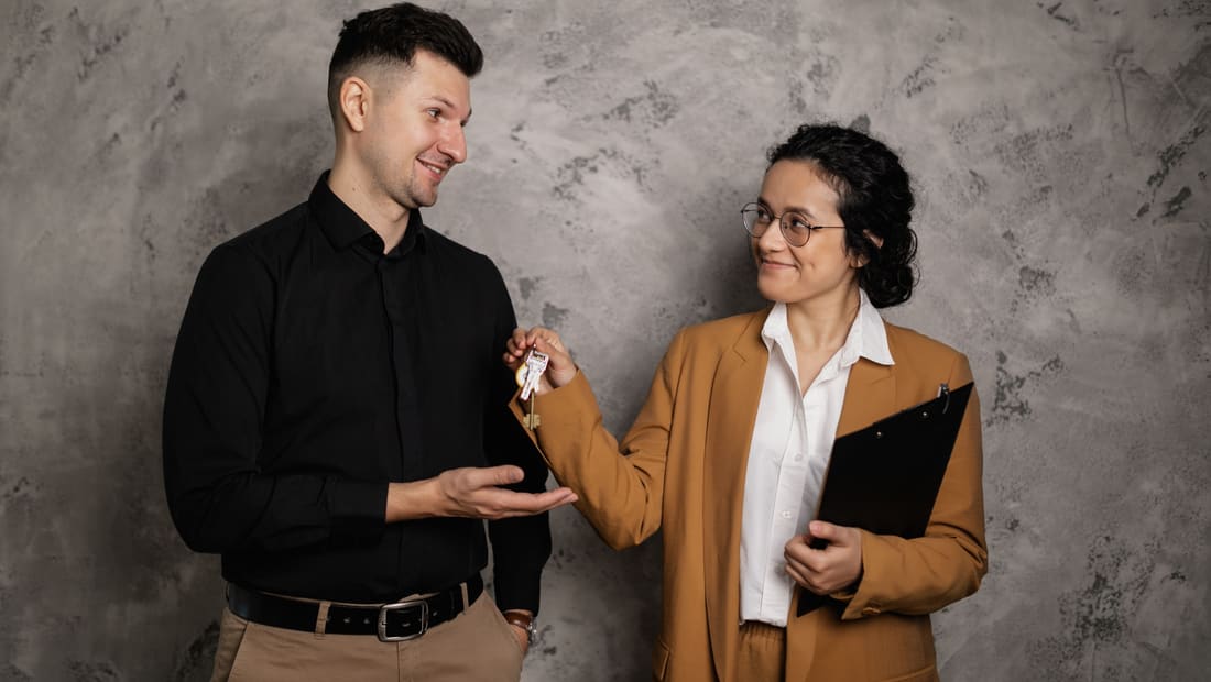 Handing over house keys after a home sale