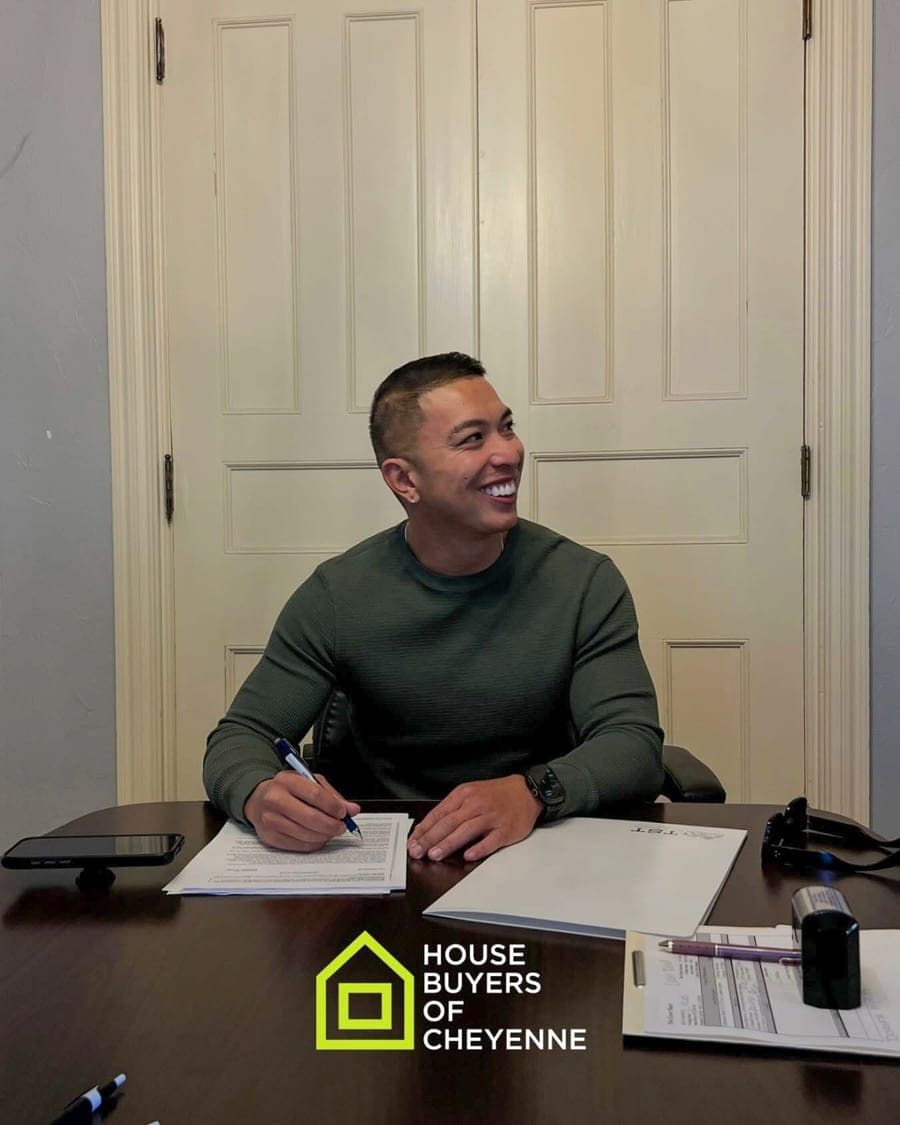 Adrian Cruz signing closing documents