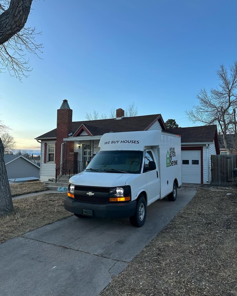 Our We Buy Houses box truck at a Cheyenne home