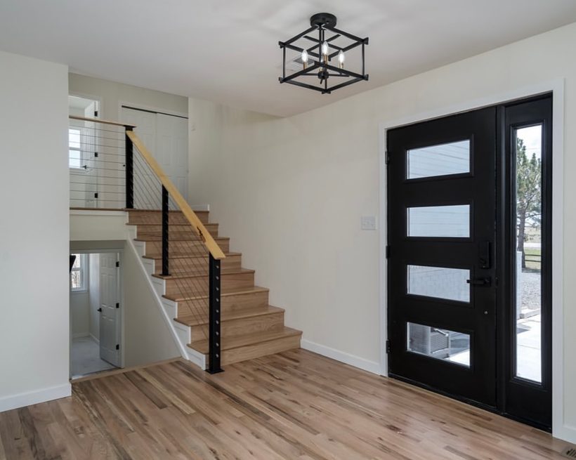 Renovated entryway and staircase by House Buyers of Cheyenne